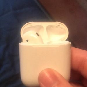 Left ear AirPods with charging case